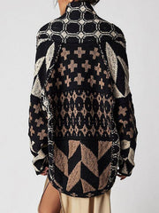 Geometric patchwork knit cardigan in black and tan with a buttoned front and collar.