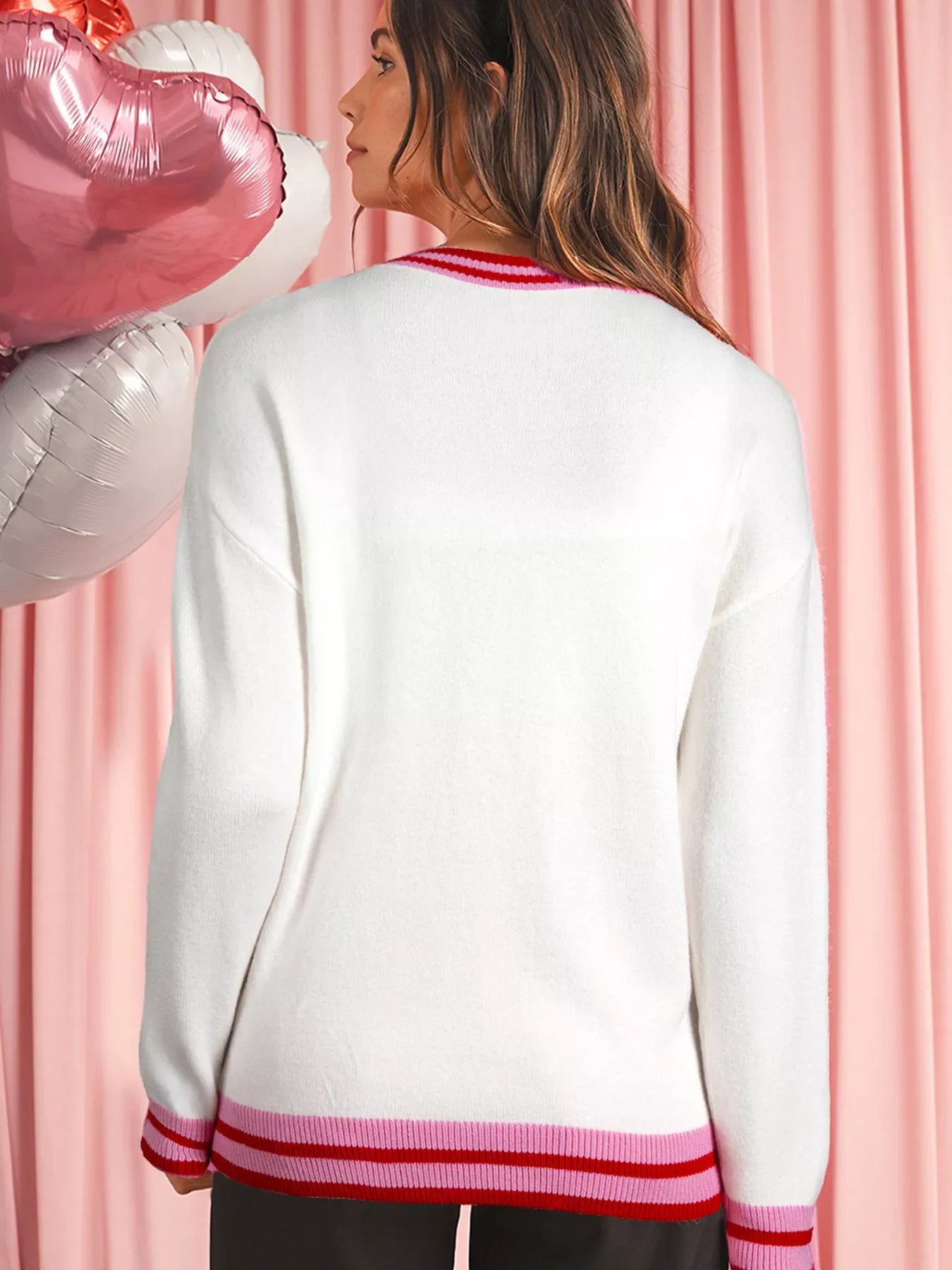 White round-neck sweater with drop shoulders and striped ribbed trim at neckline and hem.