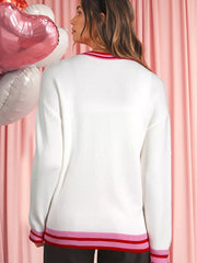 White round-neck sweater with drop shoulders and striped ribbed trim at neckline and hem.