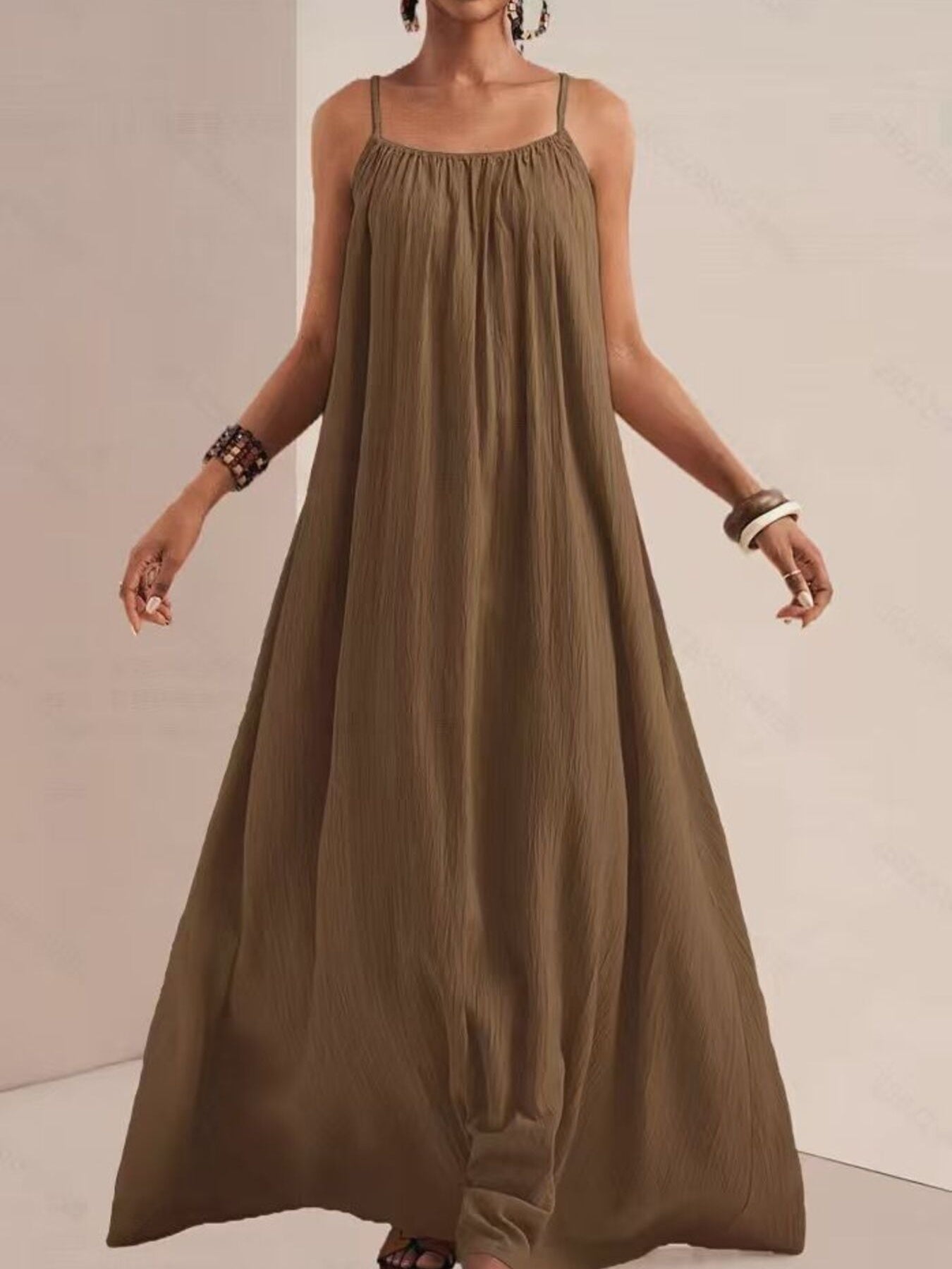 Khaki maxi swim dress with spaghetti straps and a gathered neckline.