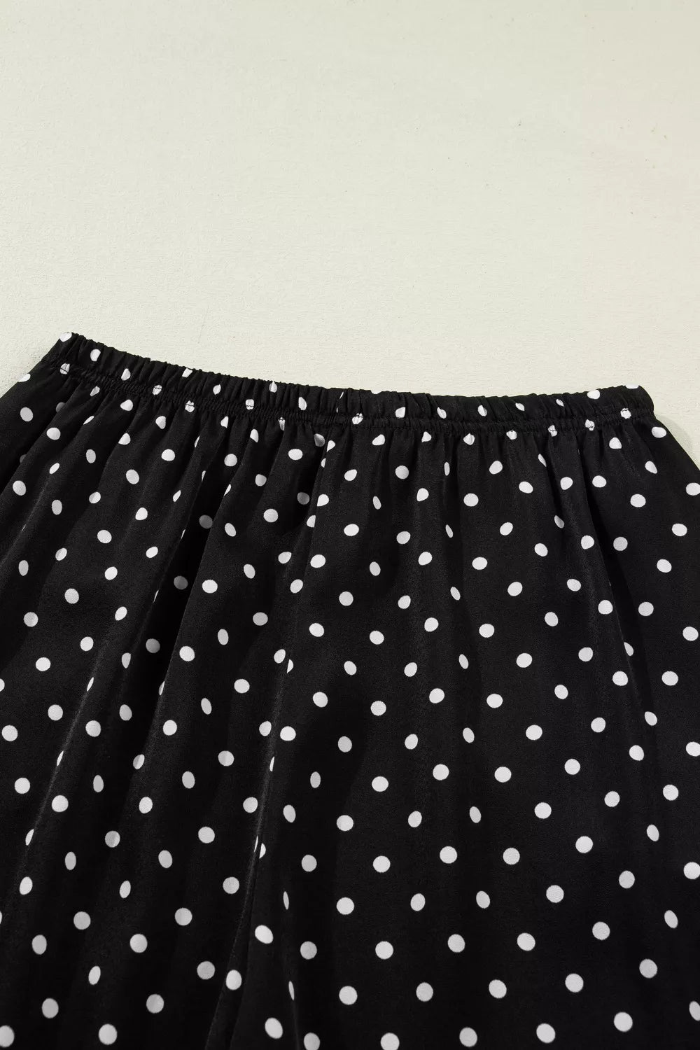 Black polka dot maternity wide-leg trousers with elastic waistband