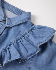 Medium wash denim shirt with a ruffled yoke and collar detail.