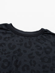 Dark gray crew neck pajama top with subtle leopard print and ribbed neckline.