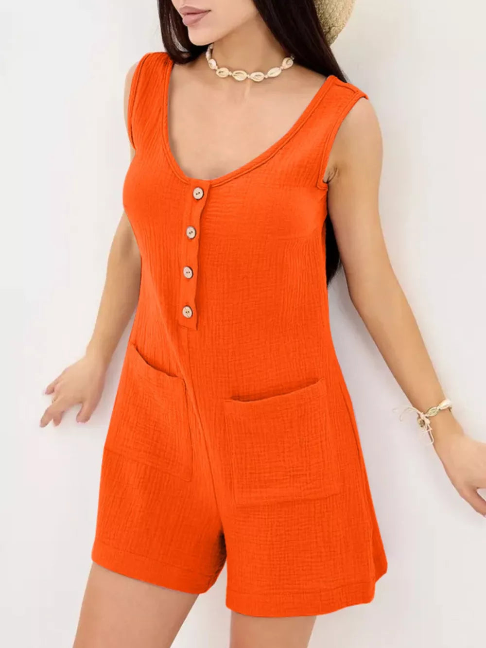 Orange crinkled cotton button-down sleeveless romper with pockets