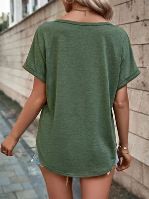 Green short sleeve t-shirt with V-neck and rolled cuffs, styled casually.