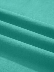 Teal mineral wash cotton tee with soft texture and subtle ribbing detail.