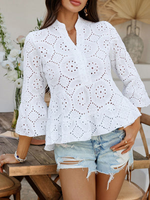White eyelet embroidered peplum blouse with ruffles and bell sleeves.