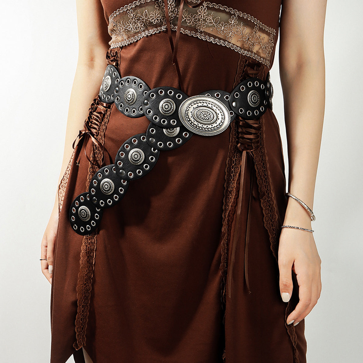 Black eyelet belt with antique silver oval buckle and studs