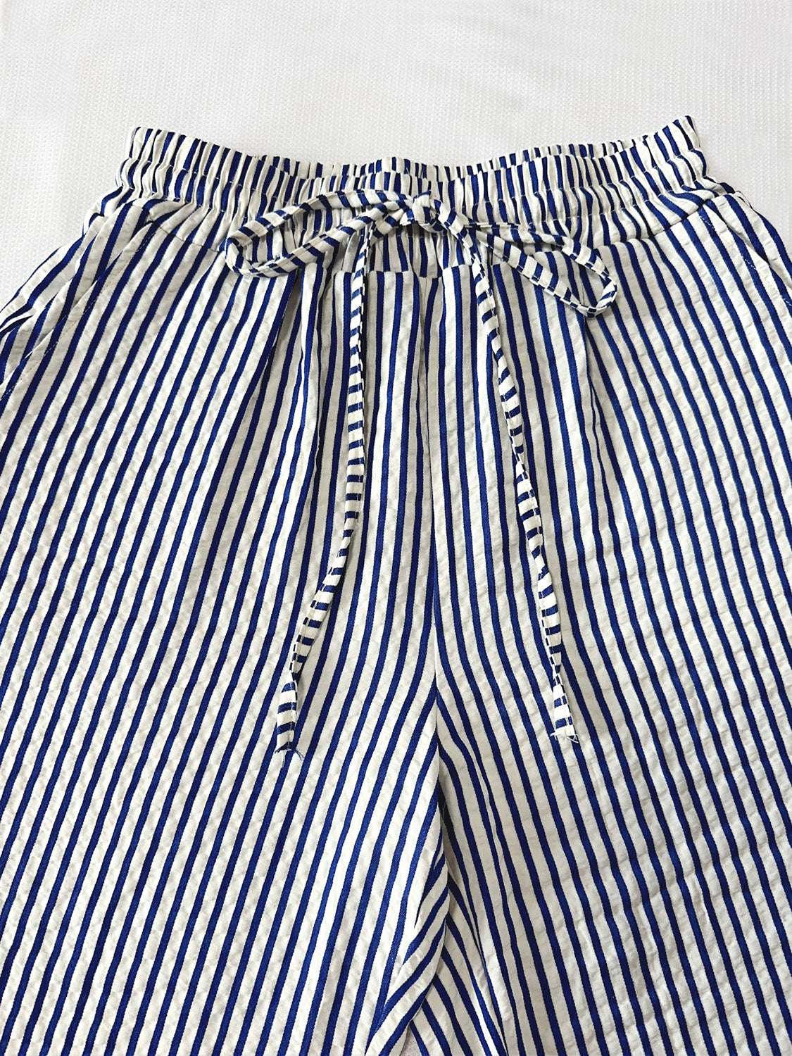 Blue and white striped wide-leg trousers with drawstring waist
