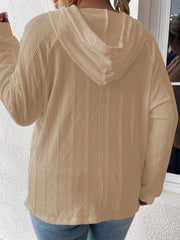 Textured knit raglan hoodie in camel with cable knit diamond pattern.
