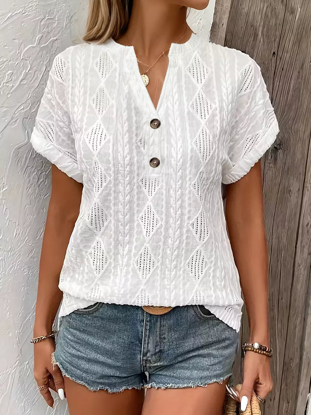White diamond pattern short-sleeve t-shirt with V-neck and button detail