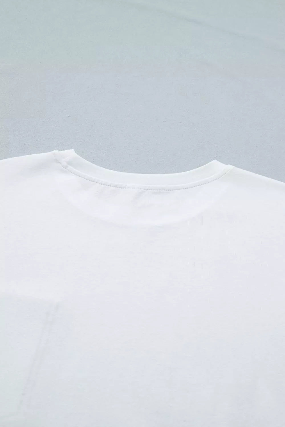 White cotton t-shirt with crew neck and pocket detail
