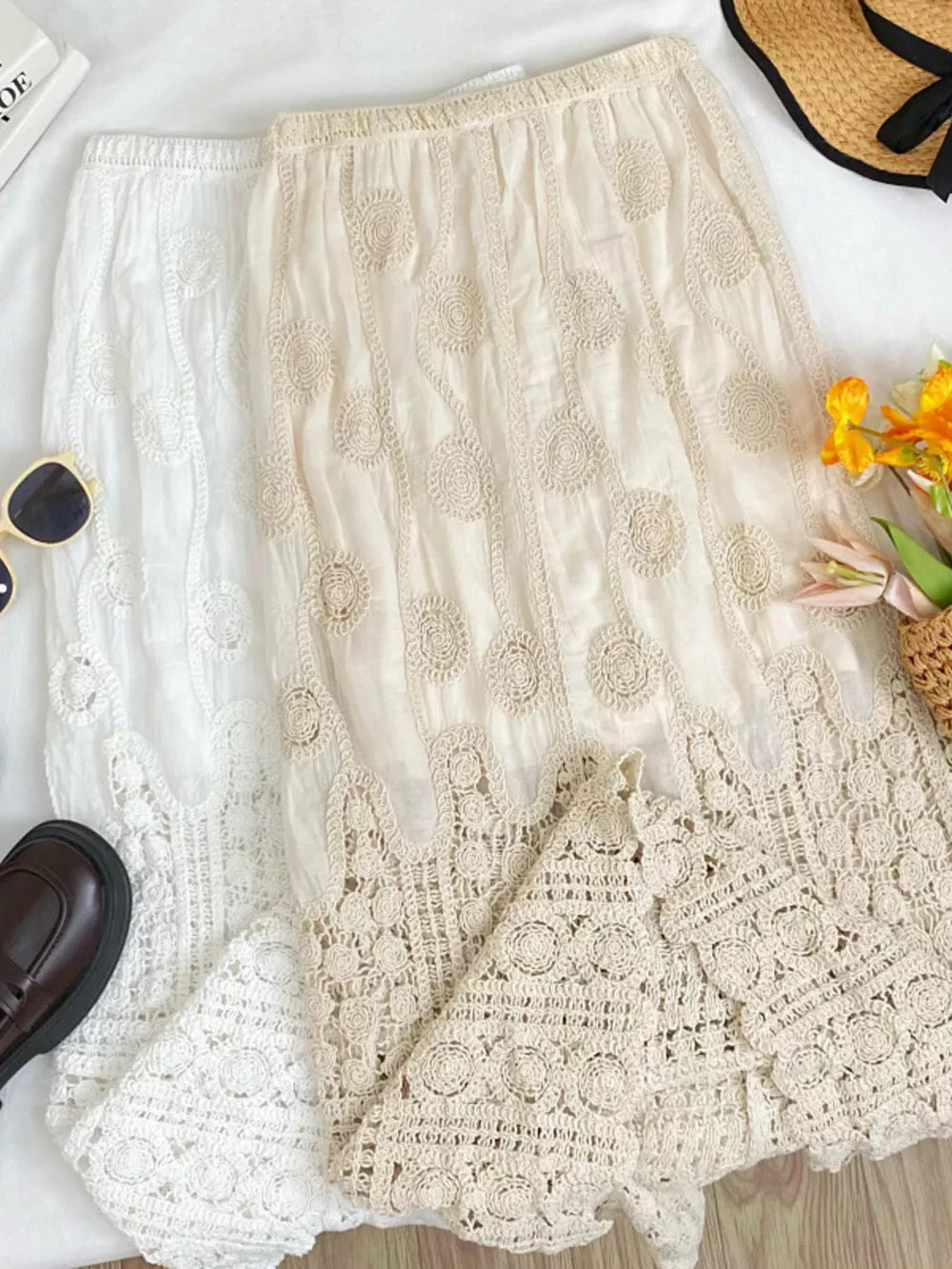 Luxe lace midi skirt in white and apricot with crochet details and elastic waist.