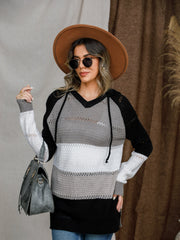 Colorblock eyelet knit hoodie with V-neck and drawstring in black, grey, and white stripes.