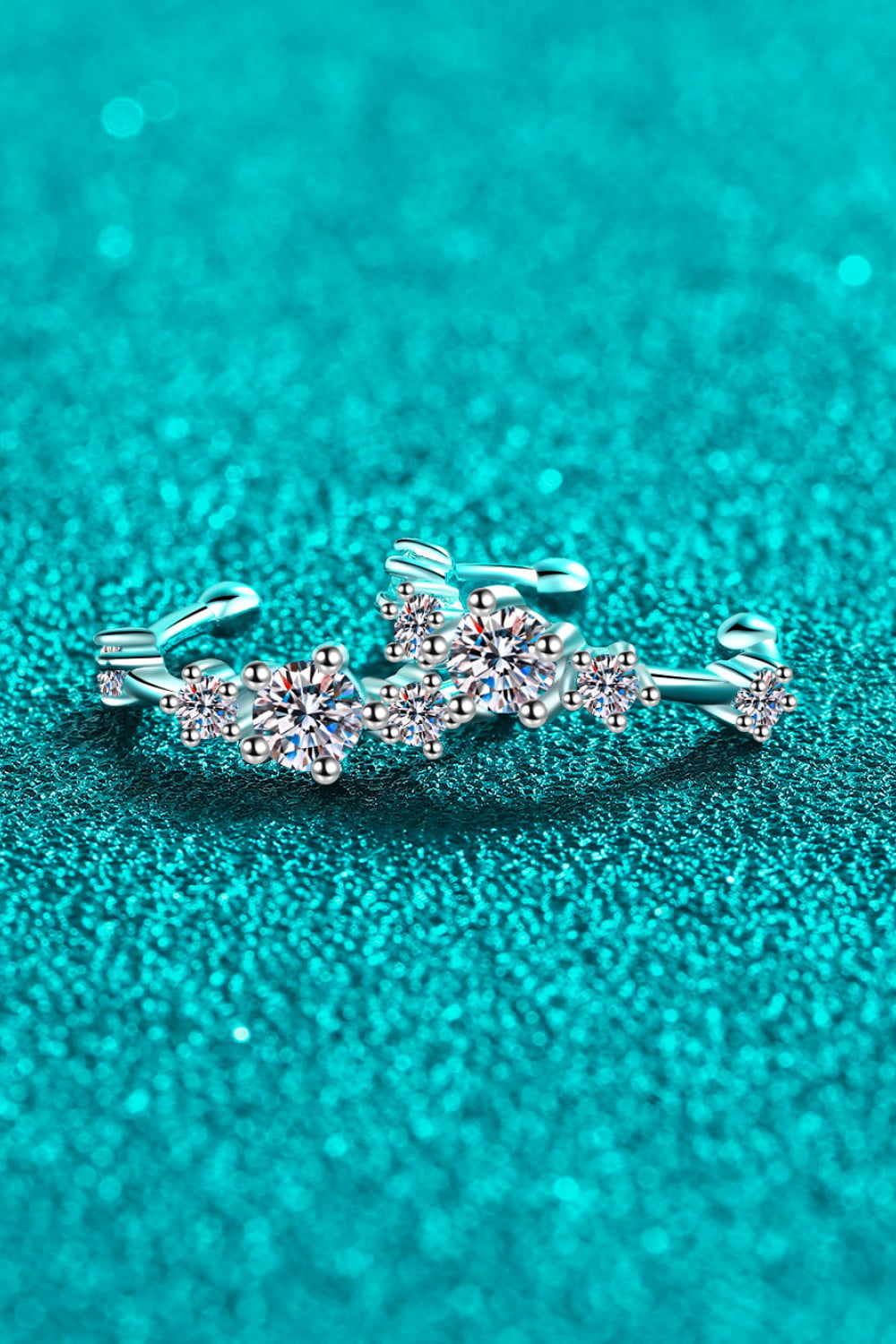 Silver ear cuffs with sparkling crystal clusters, designed as a celestial cluster.