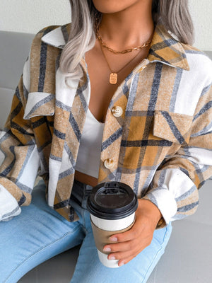 Oversized shacket with patch pockets in camel plaid, featuring button front and collar.