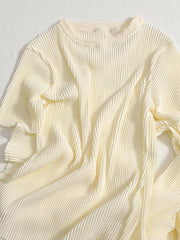 Elegant apricot pleated two-piece set with a crew neck and short sleeves.