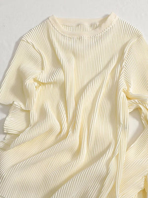Elegant apricot pleated two-piece set with a crew neck and short sleeves.