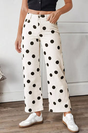 Cream polka dot high-rise jeans with a wide leg and ankle length.