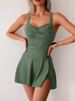 Army green one-piece swimsuit with ruched bodice and skirted bottom with side slit.