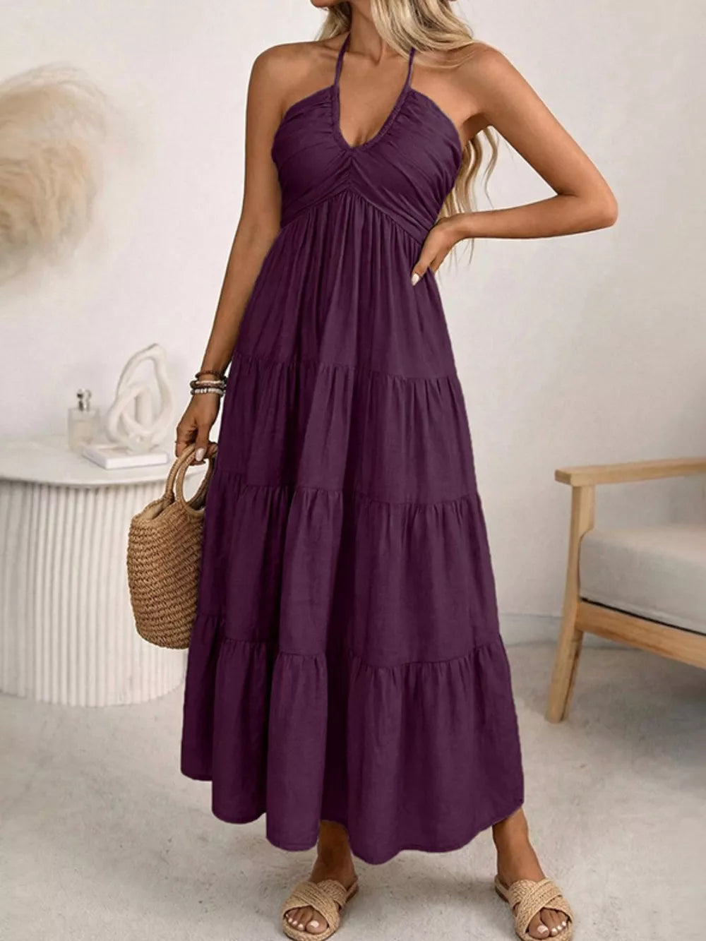Plum purple smocked halter neck midi dress with tiered skirt.