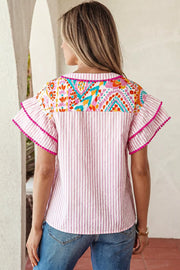 Pink striped blouse with vibrant patchwork yoke and ruffled sleeves.