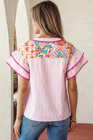 Pink striped blouse with vibrant patchwork yoke and ruffled sleeves.