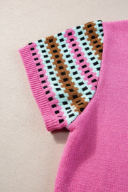 Fuchsia pink knit top with geometric patterned sleeves