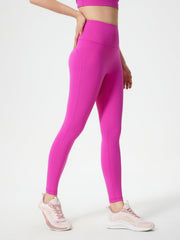 Fuchsia pink sculpted contour leggings with pocket detail and seamless stitching.