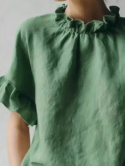 Emerald green half-sleeve shirt with ruffled neckline and sleeve details.