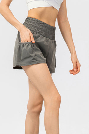 Gathered waistline active shorts in grey with pockets.