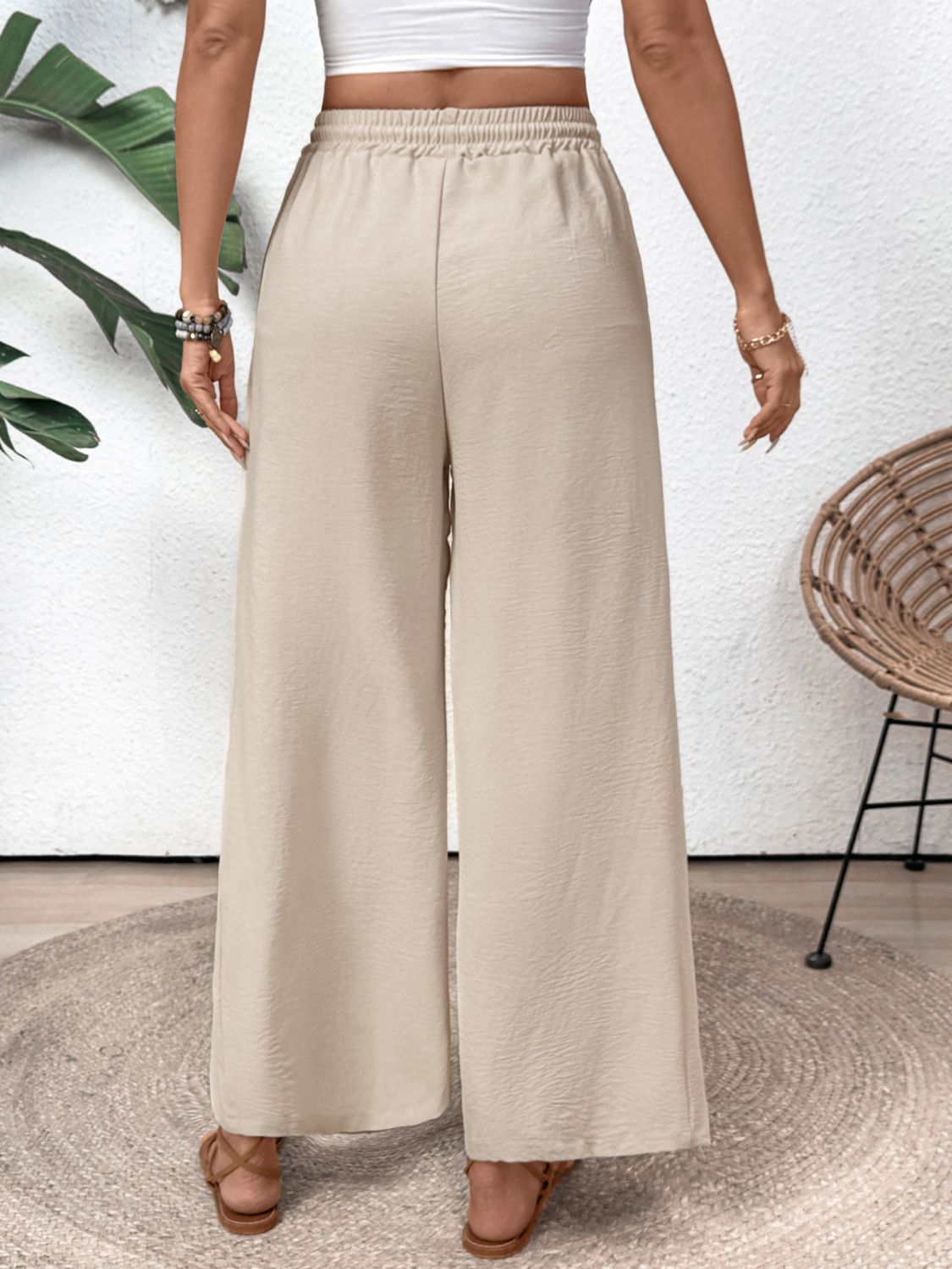 Tan palazzo trousers with drawstring waist and wide leg