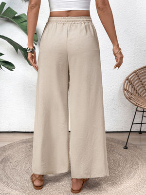 Tan palazzo trousers with drawstring waist and wide leg