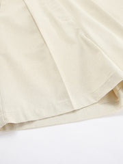 Cream cotton vest and shorts set detail showing fabric texture and pleats.
