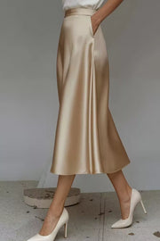 Lustrous midi skirt in Khaki with hidden pockets and A-line cut.