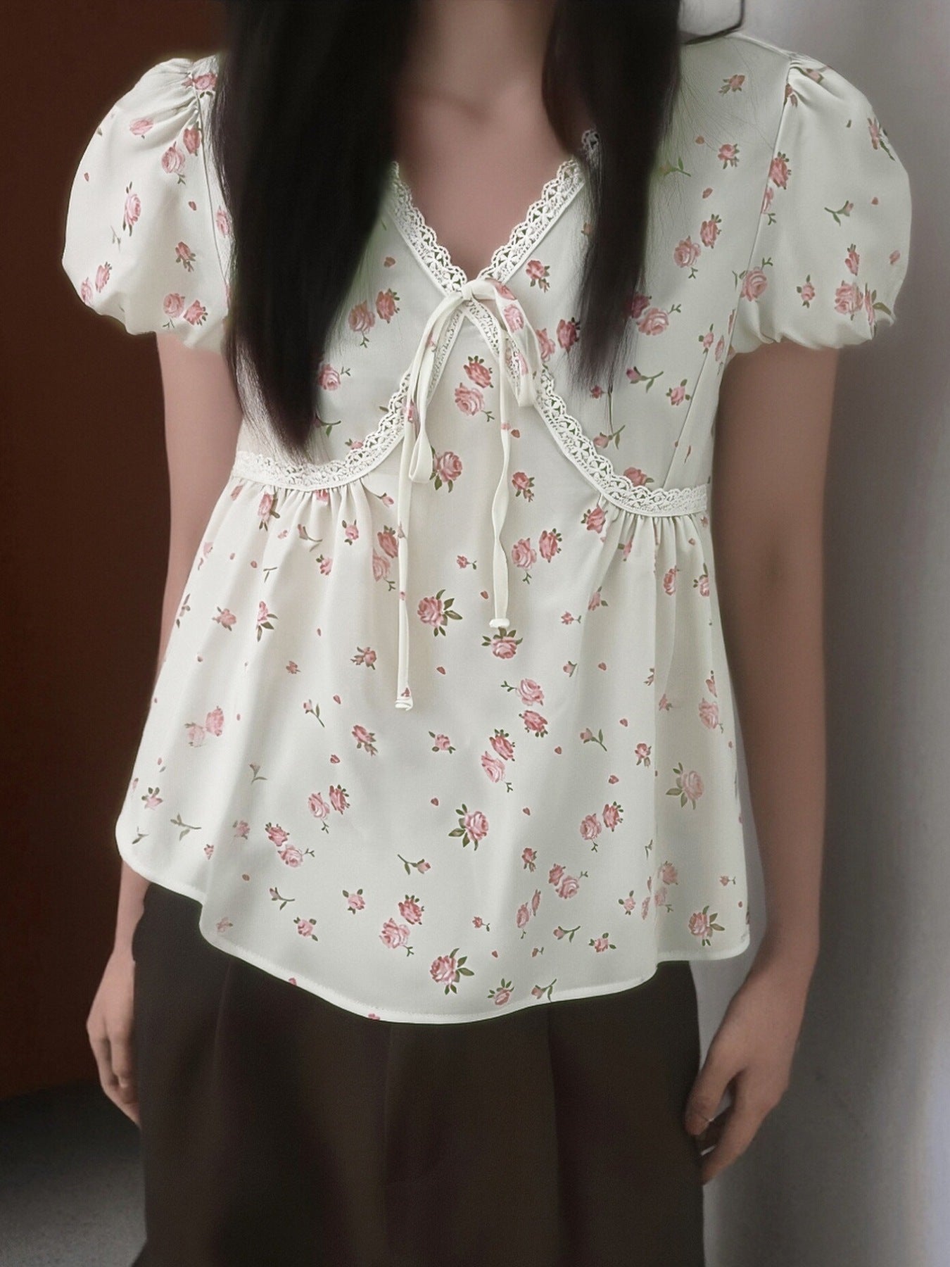 Lace-trimmed floral blouse with puff sleeves and tie-front neckline