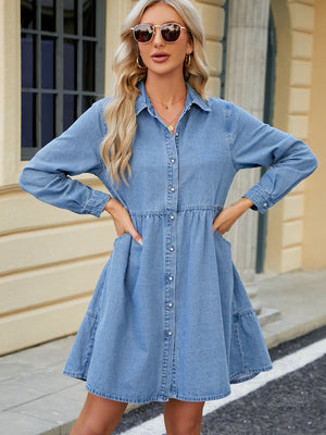 Tiered denim shirtdress in medium wash with button front, gathered waist, and pockets.
