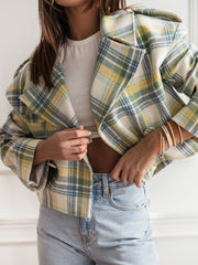 Boxy plaid cropped blazer in cream with green, yellow, and blue plaid.