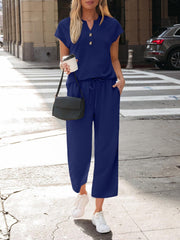 Dark blue notched V-neck top and wide-leg pants set with drawstring waist.