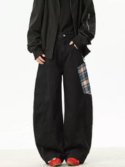 Black wide-leg sweatpants with plaid patchwork detail