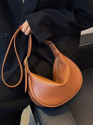 Brown minimalist crescent crossbody bag with adjustable strap
