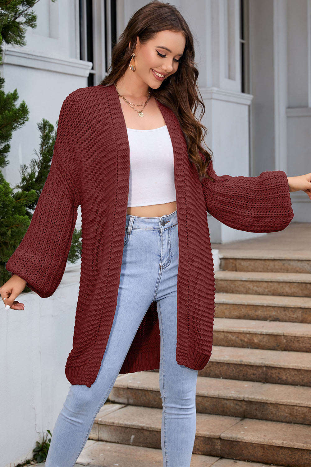 Textured knit cocoon cardigan in a deep red hue with balloon sleeves.