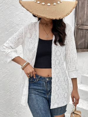 White floral lace open-front duster with pom-pom trim and 3/4 sleeves.