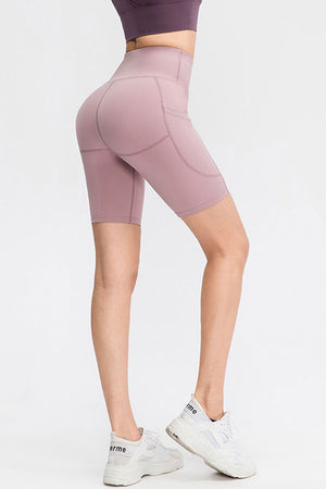 Lavender sculpting pocketed cycling shorts with a high waist and side pockets.