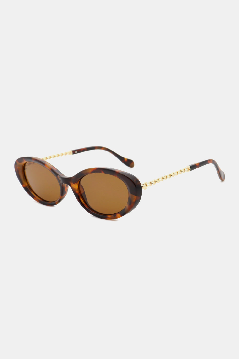 Brown tortoise oval sunglasses with gold chain detail on temples.