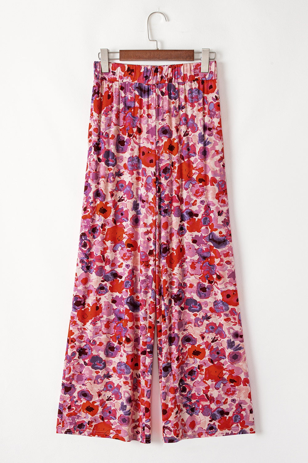 Painterly floral palazzo trousers in strawberry with a wide leg and elastic waistband.