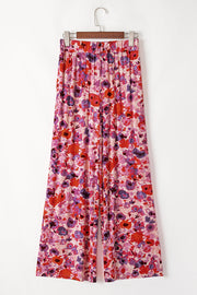 Painterly floral palazzo trousers in strawberry with a wide leg and elastic waistband.