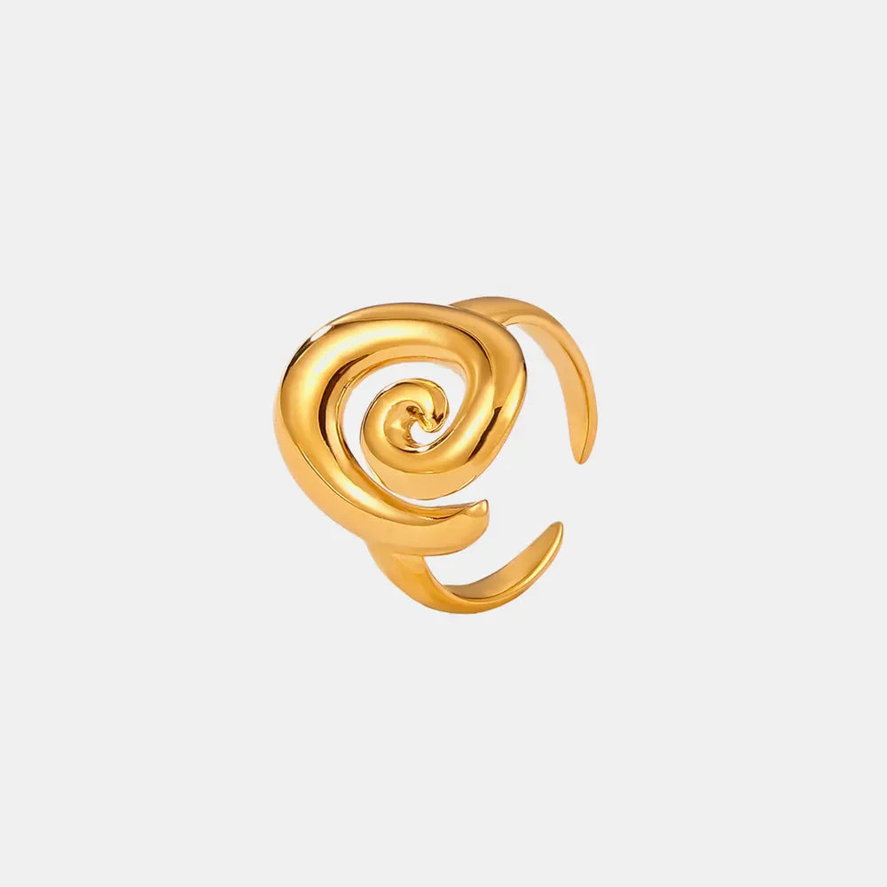 Gold sculptural swirl ring with open band design