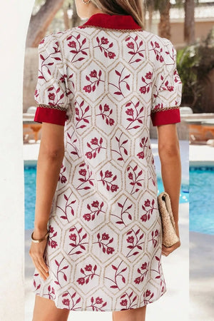 Floral print short sleeve dress with red trim and pockets, cotton blend.