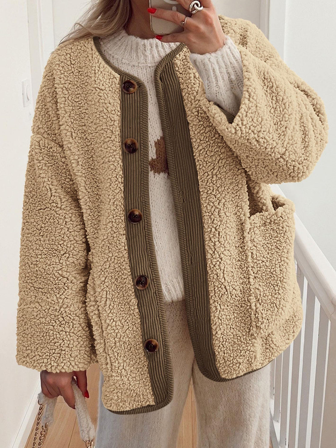 Tan teddy-texture button-up jacket with corduroy trim and button details.